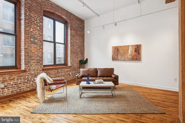 a living room with furniture and windows