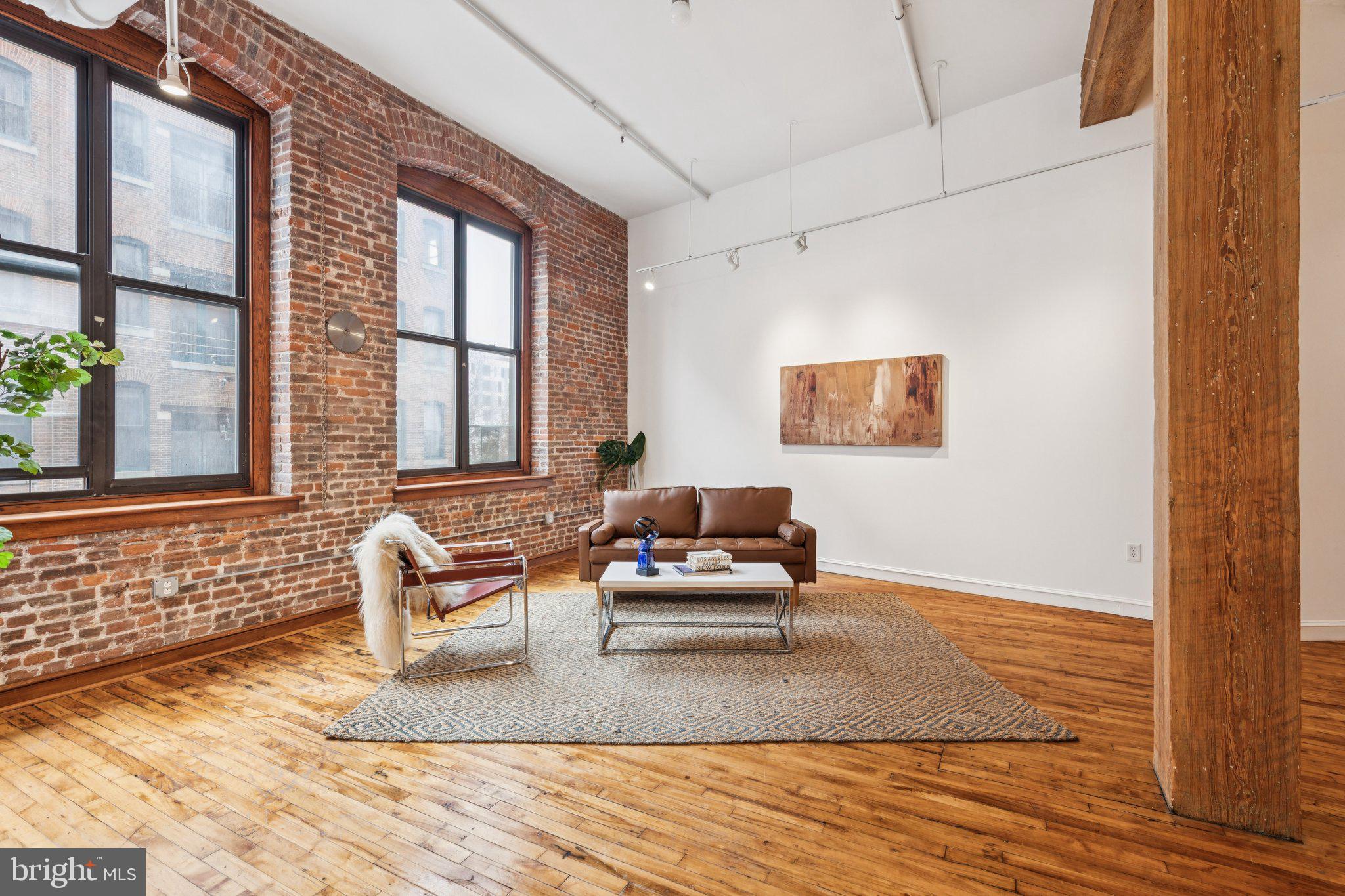 428 North 13th Street, Unit 3F Philadelphia, PA 19123 - Photo 7 of 48 a living room with furniture and a window