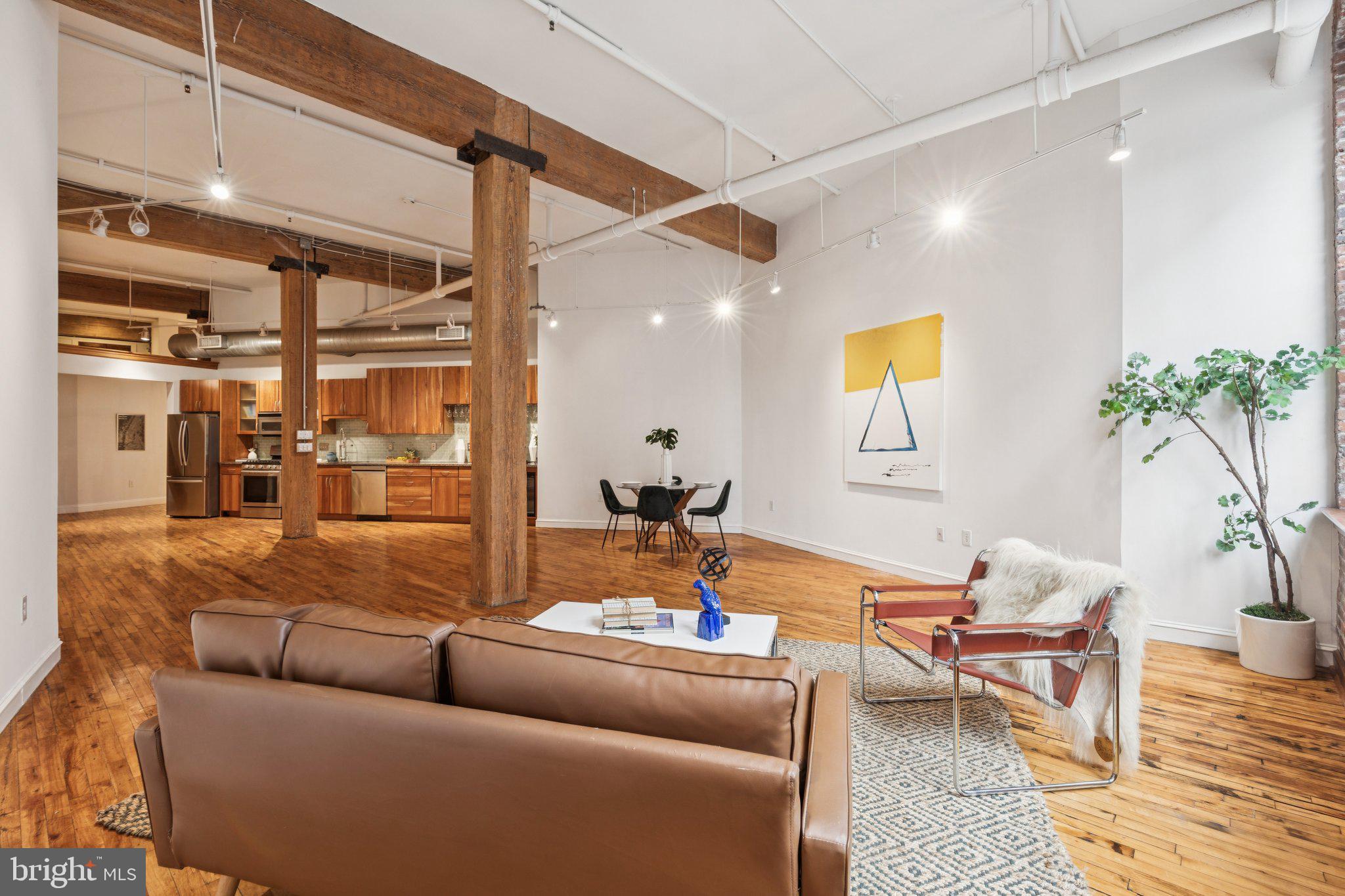 428 North 13th Street, Unit 3F Philadelphia, PA 19123 - Photo 8 of 48 a living room with furniture and wooden floor