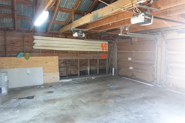 a view of a house with wooden fence