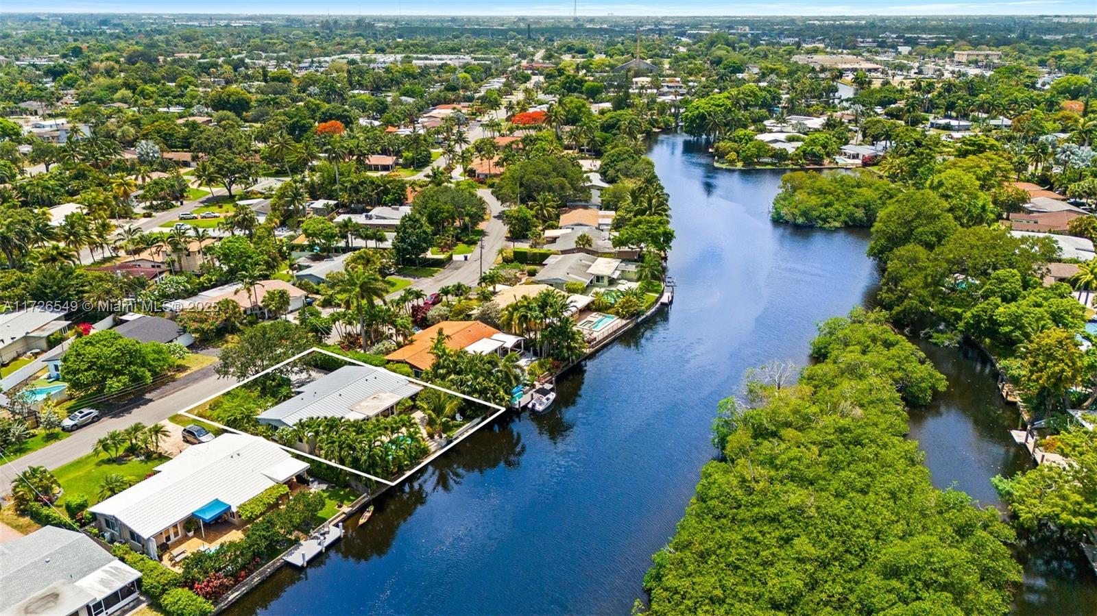 425 Northeast 29th Street Wilton Manors, FL 33334 - Photo 1 of 30 an aerial view of residential houses with outdoor space and trees