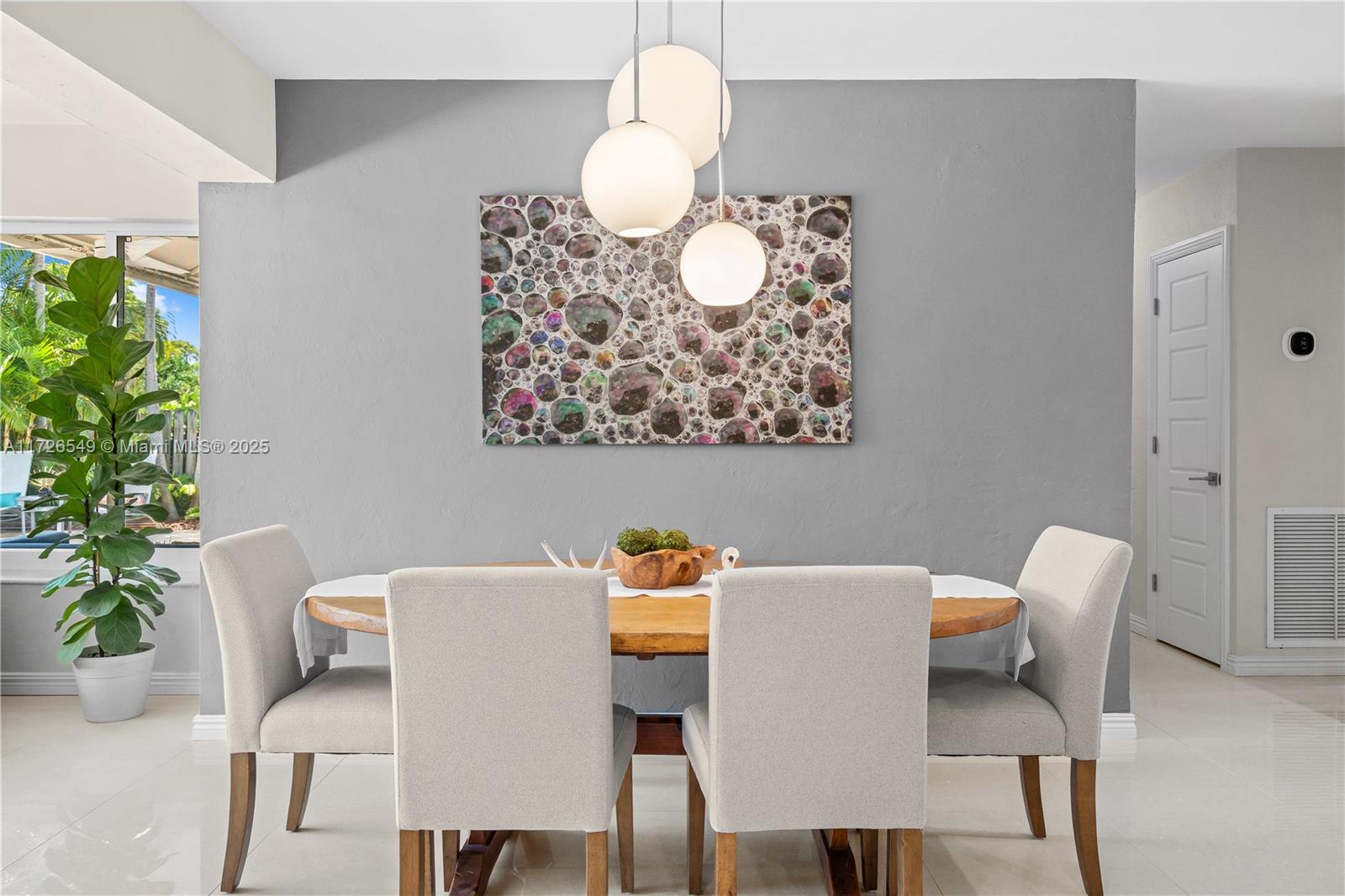 425 Northeast 29th Street Wilton Manors, FL 33334 - Photo 16 of 30 a workspace with furniture and a potted plant