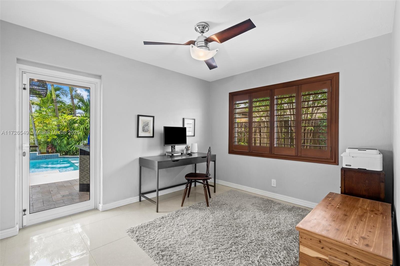 425 Northeast 29th Street Wilton Manors, FL 33334 - Photo 20 of 30 a workspace with furniture and a window
