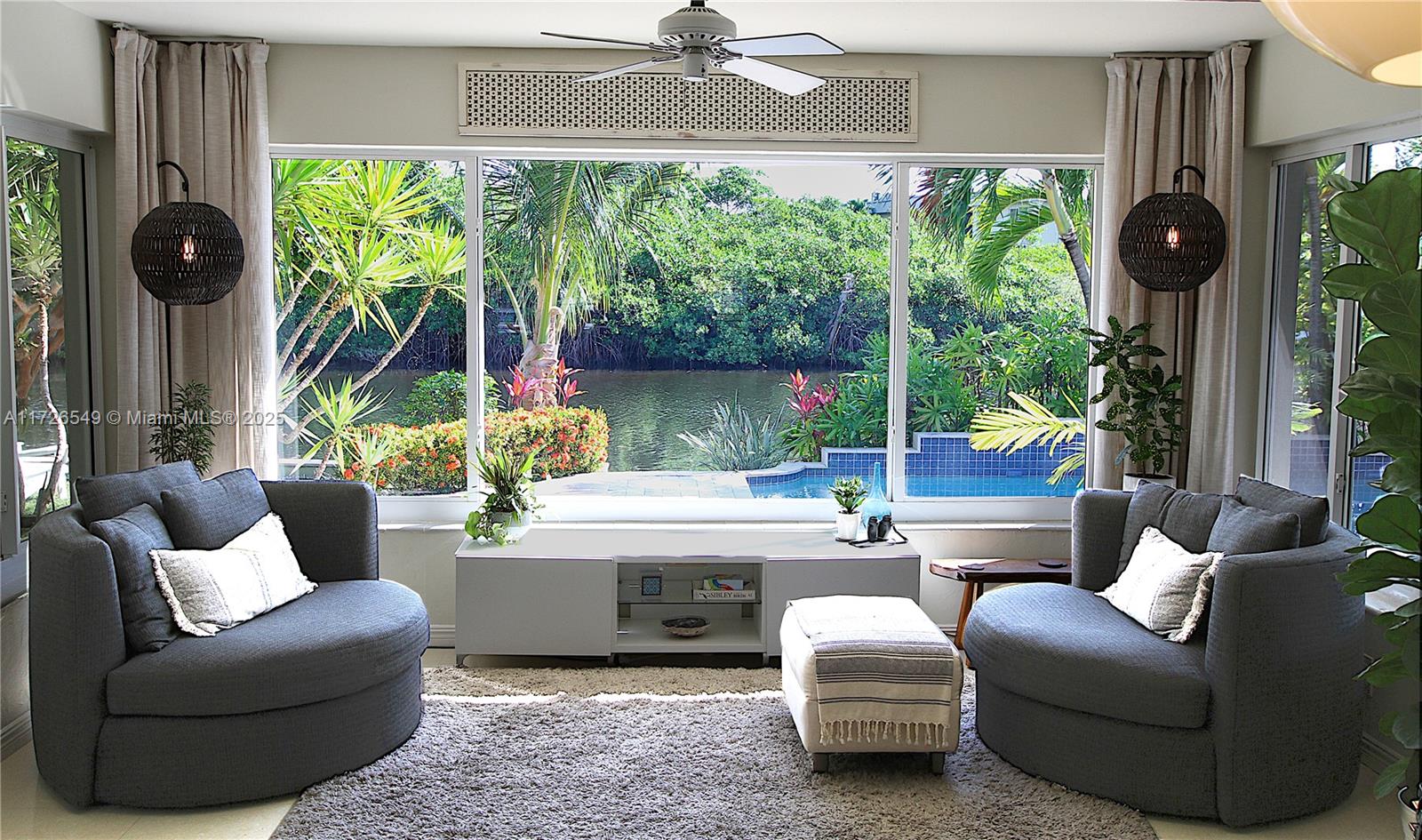 425 Northeast 29th Street Wilton Manors, FL 33334 - Photo 2 of 30 a living room with furniture and a large window