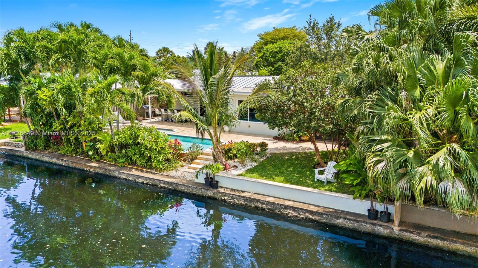 425 Northeast 29th Street Wilton Manors, FL 33334 - Photo 27 of 30 a view of swimming pool with a yard