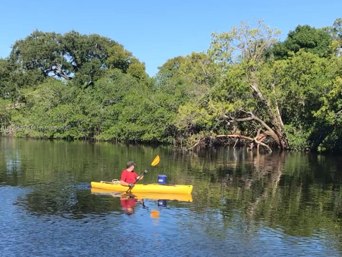 425 Northeast 29th Street Wilton Manors, FL 33334 - Photo 29 of 30 a view of a lake with a house in the background