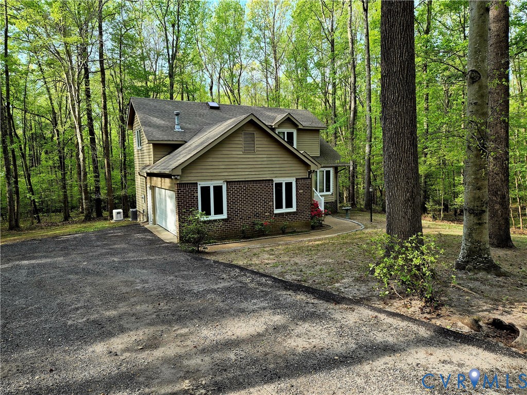 4099 Doe Run Road Hopewell, VA 23860 - Photo 4 of 35 a house with trees in the background