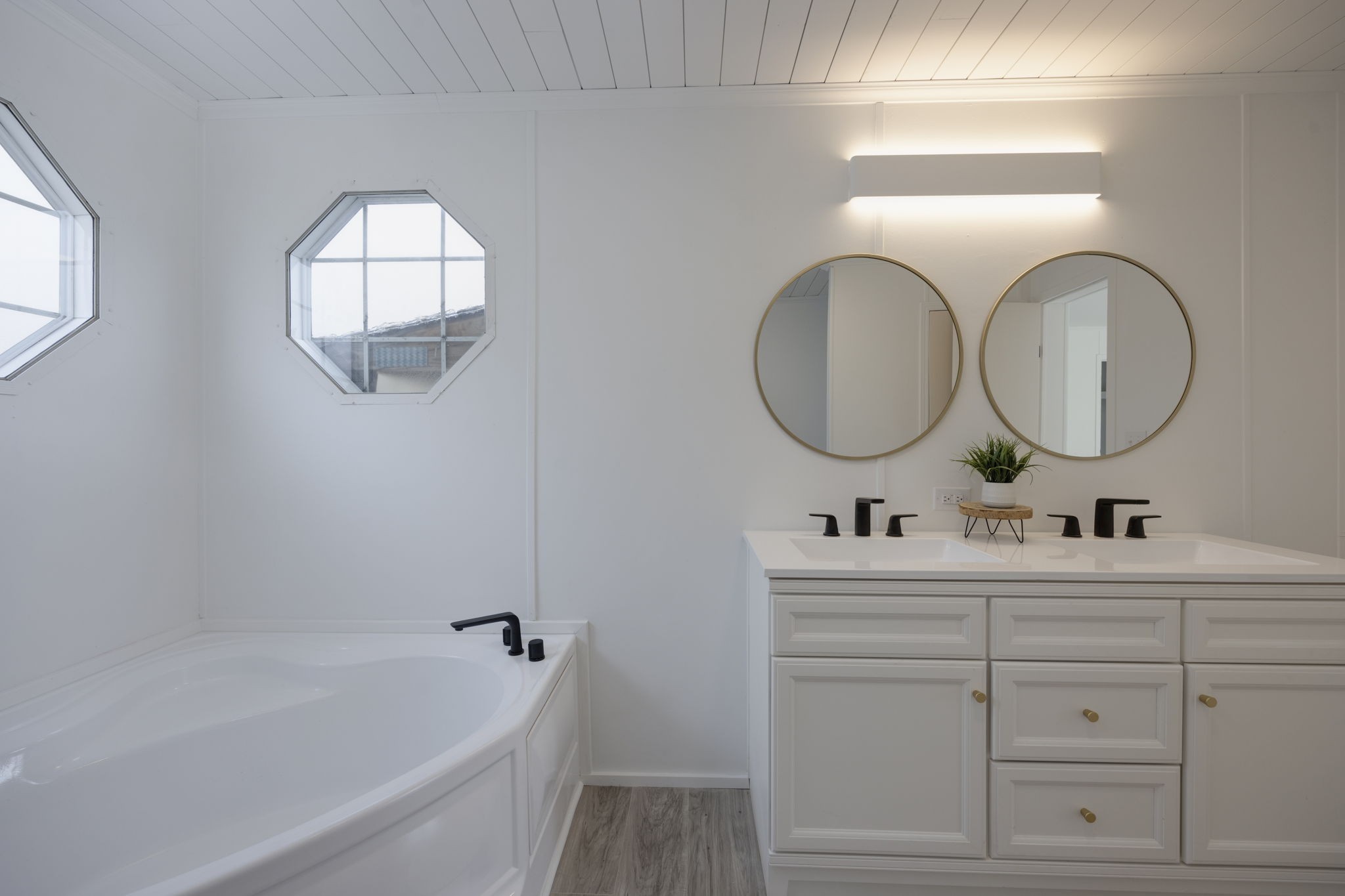 4538 Southside Road Southside, TN 37171 - Photo 11 of 35 a bathroom with a double vanity sink mirror and bathtub