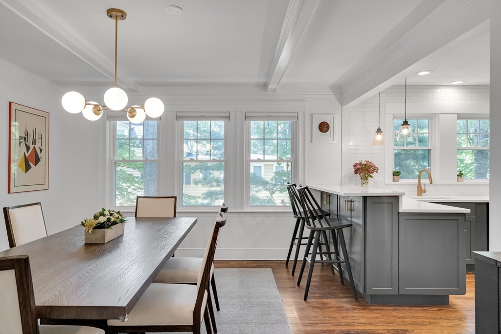 30 Perkins Street, Unit 1 Newton, MA 02465 - Photo 11 of 34 a view of a dining room with furniture window and wooden floor