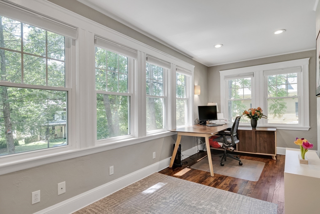 30 Perkins Street, Unit 1 Newton, MA 02465 - Photo 12 of 34 a view of a workspace with wooden floor and a window