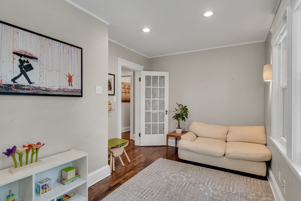 30 Perkins Street, Unit 1 Newton, MA 02465 - Photo 13 of 34 a living room with furniture and painting on the wall