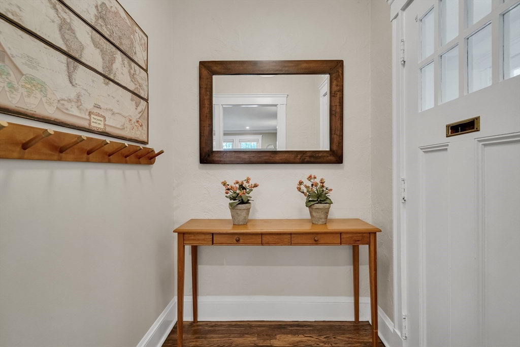 30 Perkins Street, Unit 1 Newton, MA 02465 - Photo 2 of 34 a bathroom with a sink mirror and vanity