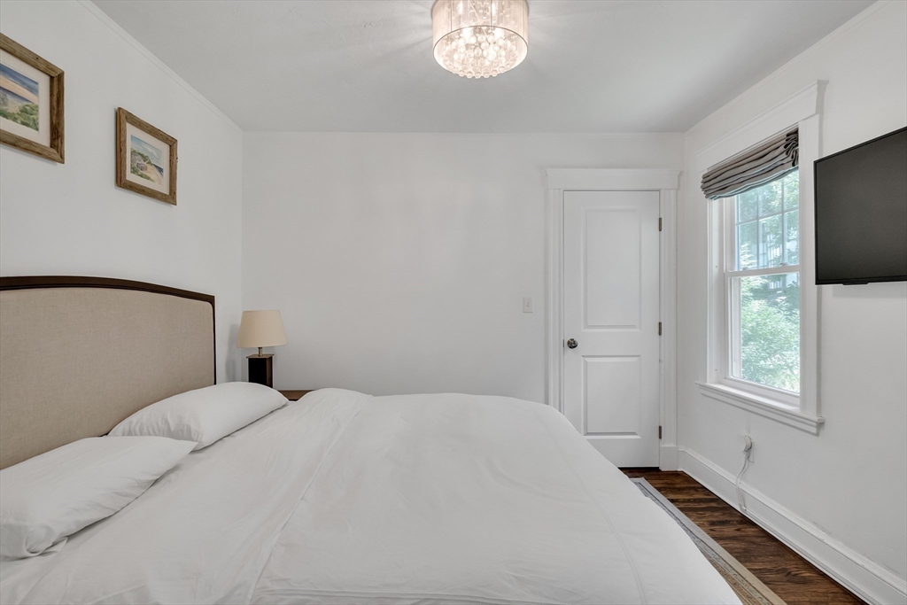 30 Perkins Street, Unit 1 Newton, MA 02465 - Photo 26 of 34 a bedroom with a bed and a window