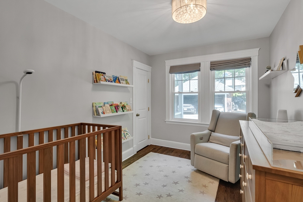 30 Perkins Street, Unit 1 Newton, MA 02465 - Photo 29 of 34 a bedroom with furniture and a window
