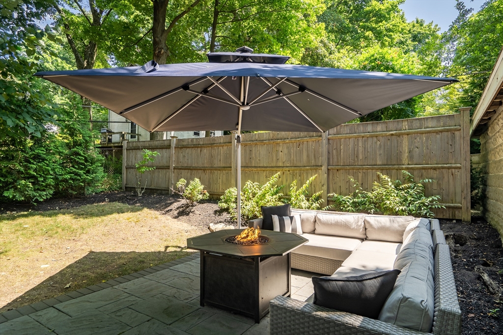 30 Perkins Street, Unit 1 Newton, MA 02465 - Photo 31 of 34 a view of a backyard with sitting area and furniture