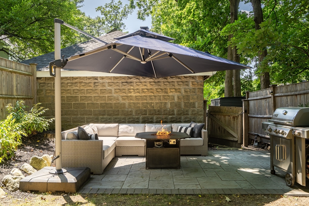 30 Perkins Street, Unit 1 Newton, MA 02465 - Photo 32 of 34 a patio with patio a couch and chairs