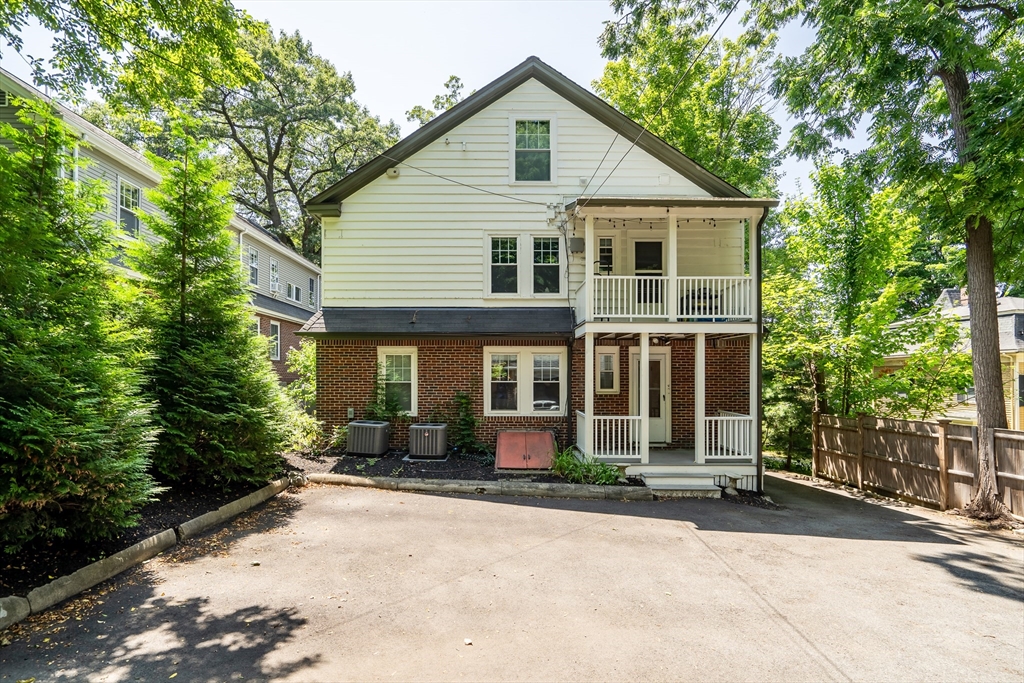 30 Perkins Street, Unit 1 Newton, MA 02465 - Photo 33 of 34 front view of a house and a yard