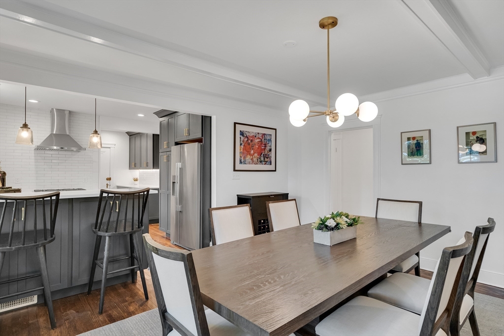 30 Perkins Street, Unit 1 Newton, MA 02465 - Photo 8 of 34 a view of a dining room with furniture and wooden floor