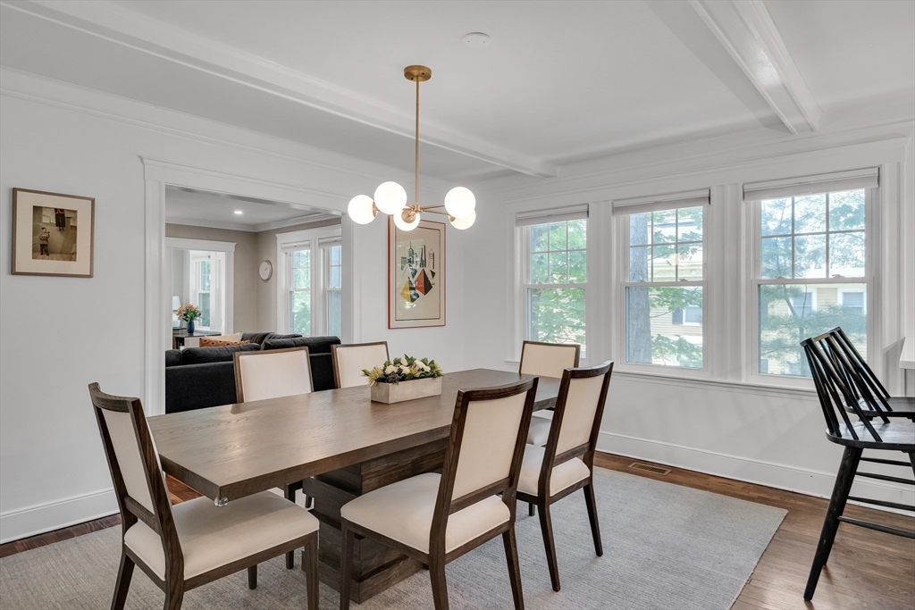 30 Perkins Street, Unit 1 Newton, MA 02465 - Photo 10 of 34 a view of a dining room with furniture a chandelier and wooden floor