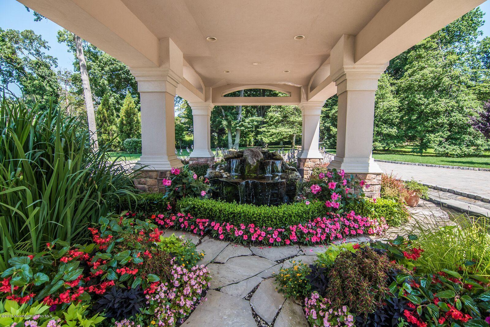 112 Hartshorne Road Middletown, NJ 07760 - Photo 14 of 86 a view of a garden with flowers and trees