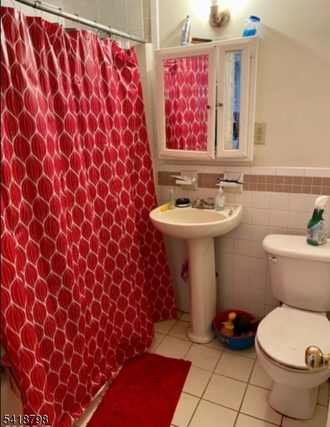 150 Atlanta Avenue Union, NJ 07088 - Photo 12 of 26 a bathroom with a sink and a toilet