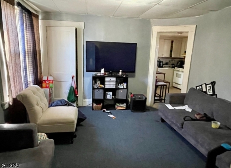 150 Atlanta Avenue Union, NJ 07088 - Photo 14 of 26 a living room with furniture and a flat screen tv