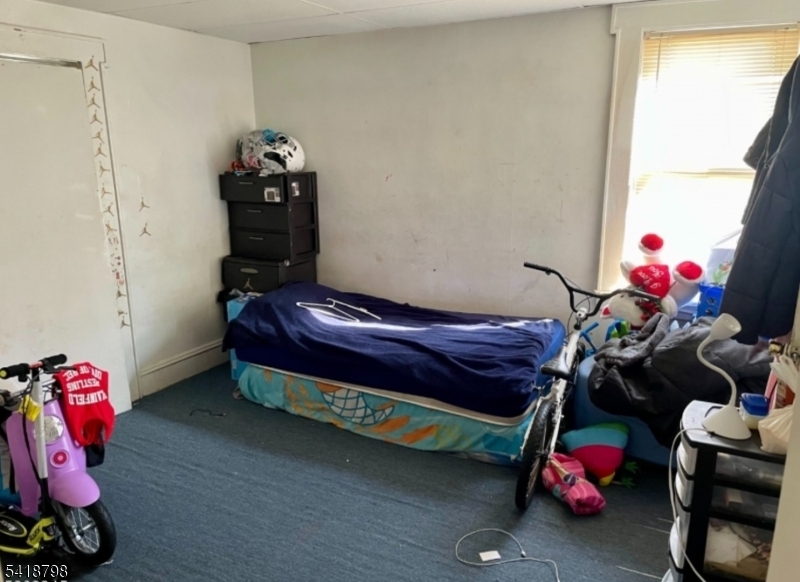 150 Atlanta Avenue Union, NJ 07088 - Photo 16 of 26 a bedroom with a bed and a window