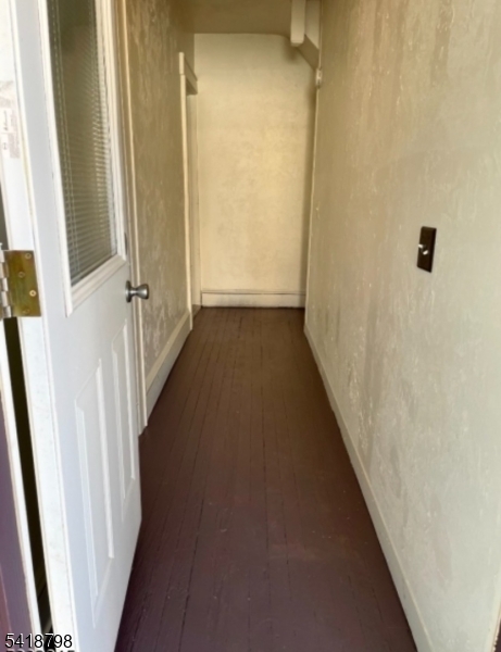 150 Atlanta Avenue Union, NJ 07088 - Photo 4 of 26 a view of a hallway with wooden floor and staircase