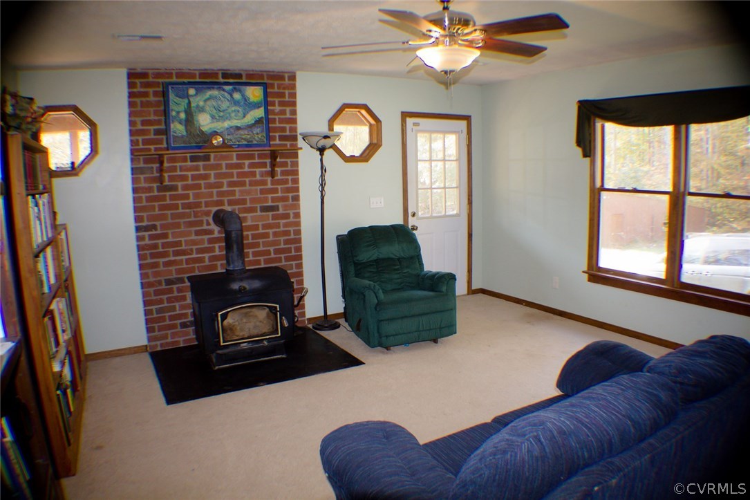 567 Little River Farms Road Bumpass, VA 23024 - Photo 6 of 22 Family room showing rear entrance, ceiling fan and