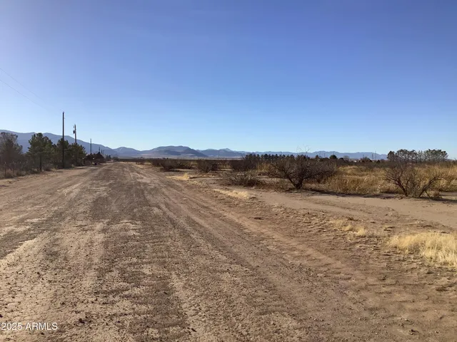 a view of an ocean beach and mountain