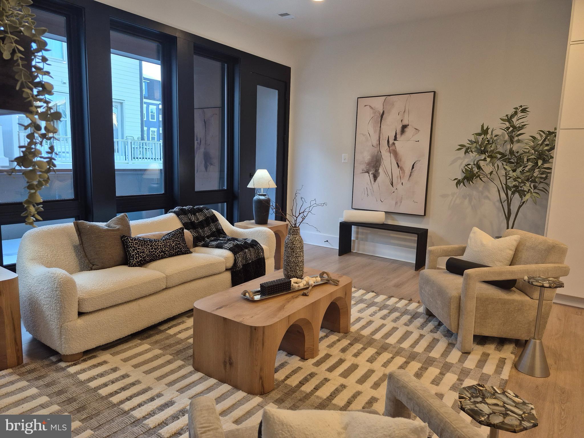 14944 Dispatch Street, Unit 2 Rockville, MD 20850 - Photo 14 of 36 a living room with furniture and a large window
