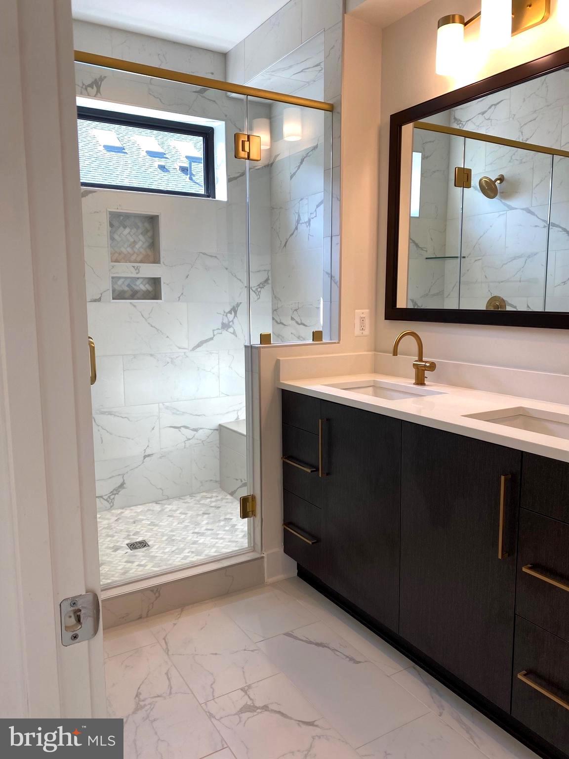 14944 Dispatch Street, Unit 2 Rockville, MD 20850 - Photo 20 of 36 a bathroom with a sink and a mirror