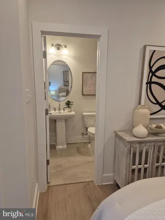 a bathroom with mirror a sink and a mirror