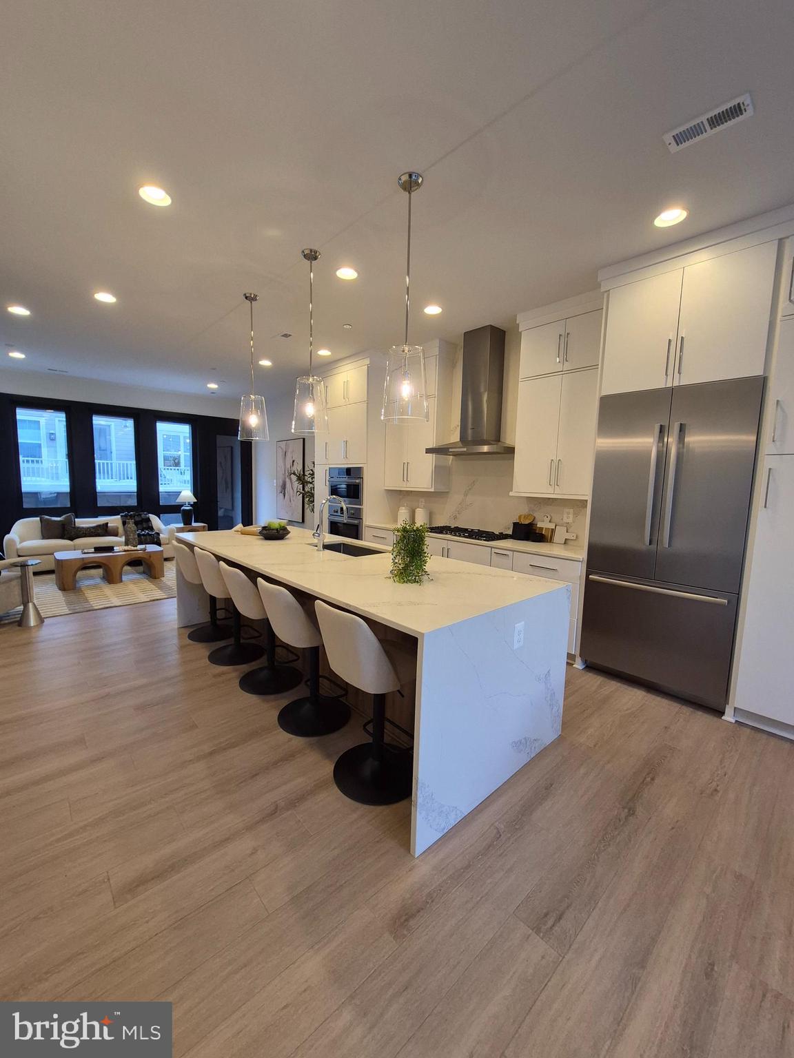 14944 Dispatch Street, Unit 2 Rockville, MD 20850 - Photo 8 of 36 a large kitchen with stainless steel appliances lots of counter space and a sink
