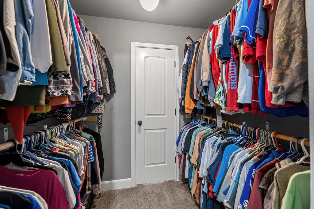 116 Jasper Lane North Kerrville, TX 78028 - Photo 15 of 27 a view of walk in closet with clothes