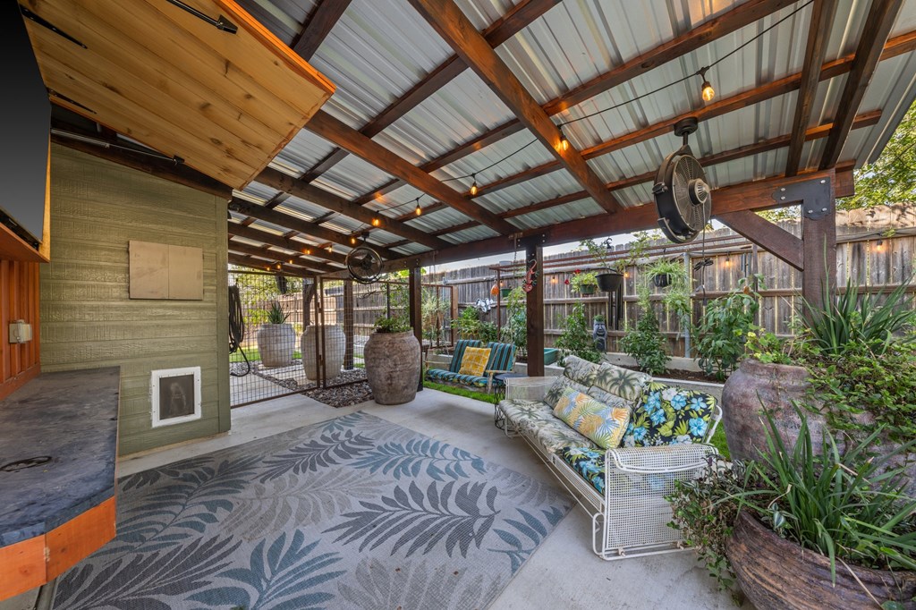 116 Jasper Lane North Kerrville, TX 78028 - Photo 17 of 27 a view of a patio with table and chairs potted plants with wooden floor