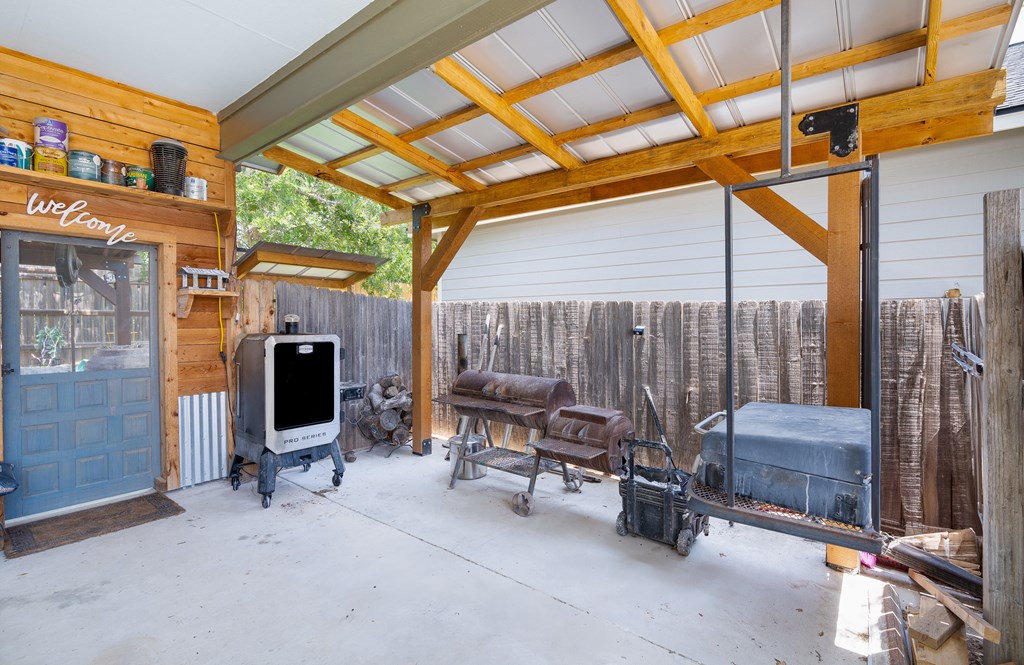 116 Jasper Lane North Kerrville, TX 78028 - Photo 2 of 27 a view of patio with a table and chairs and a barbeque