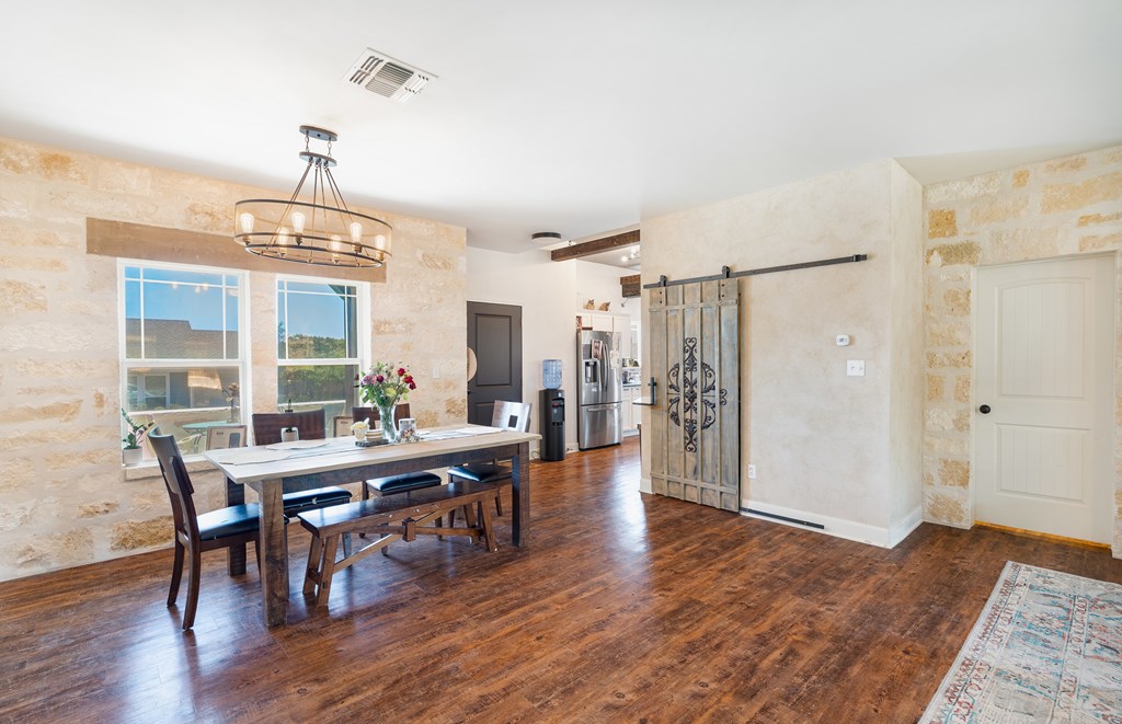 116 Jasper Lane North Kerrville, TX 78028 - Photo 4 of 27 a view of a dining room with furniture window and wooden floor