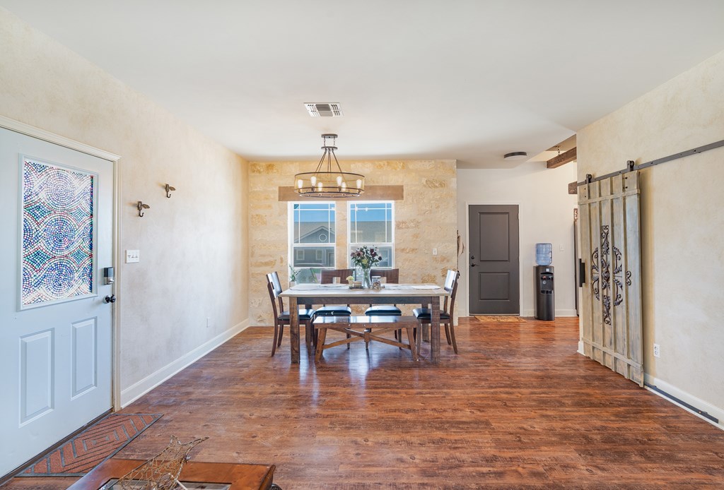 116 Jasper Lane North Kerrville, TX 78028 - Photo 5 of 27 a view of a dining room with furniture and chandelier