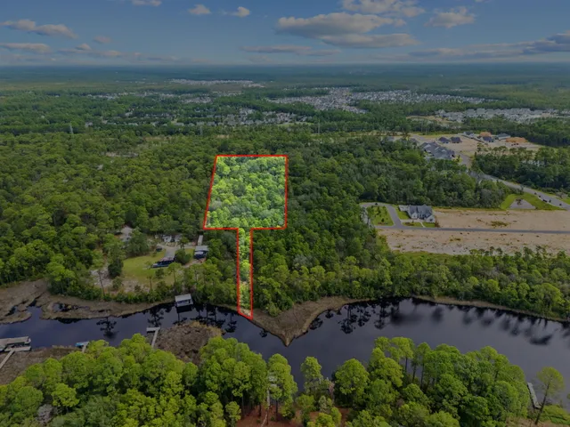 an aerial view of a houses with outdoor space