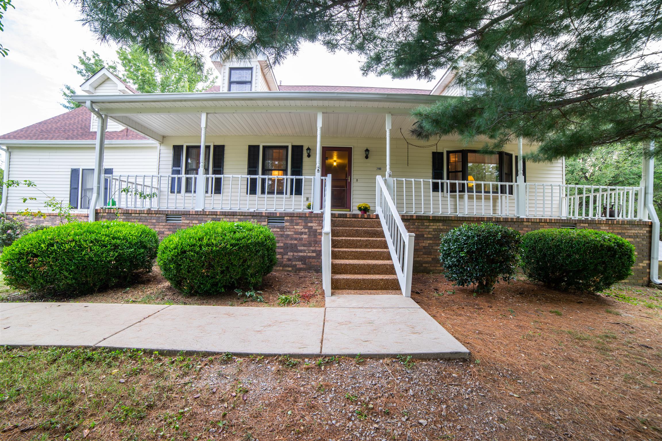 2190 Glencoe Road Culleoka, TN 38451 - Photo 2 of 30 Private Front Porch and Entry with large mature trees throughout the front yard.