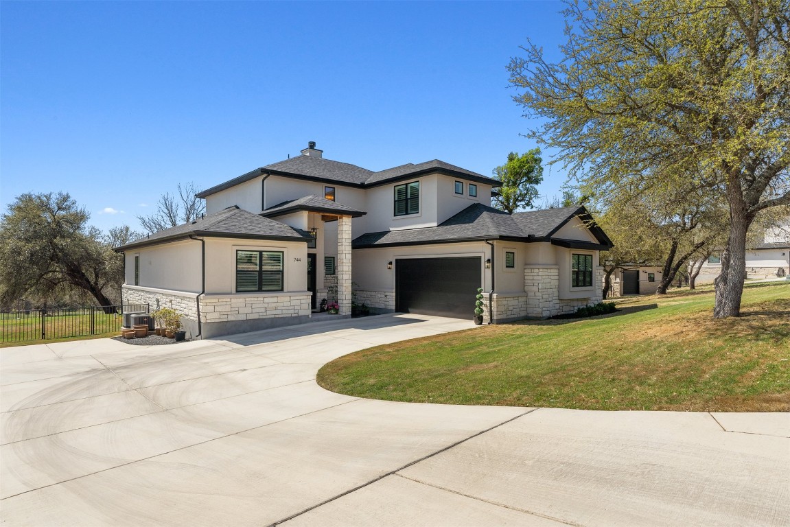 744 Buffalo Trail Liberty Hill, TX 78642 - Photo 1 of 1 a front view of a house with a yard and garage