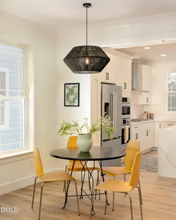 a dining room with furniture and window