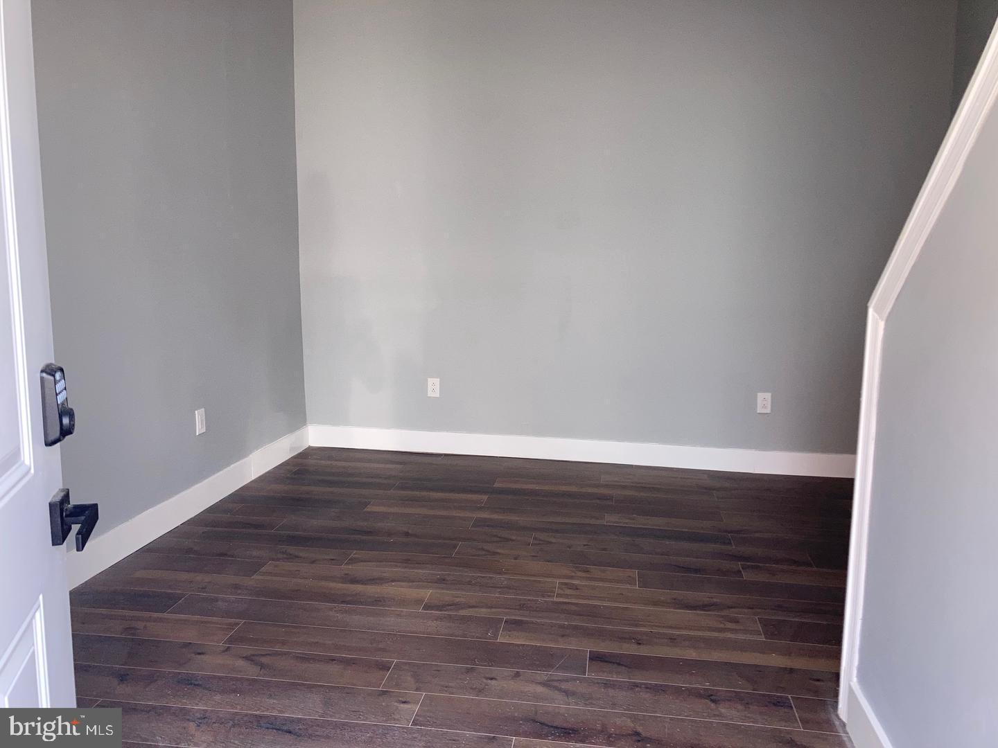 1815 South 23rd Street, Unit 1 Philadelphia, PA 19145 - Photo 12 of 13 a view of an empty room with wooden floor