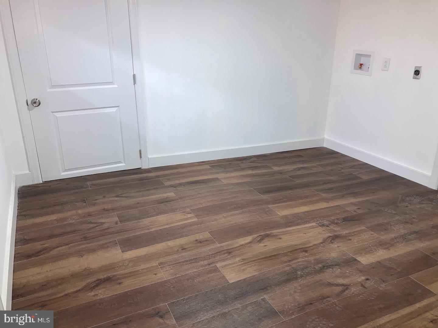 1815 South 23rd Street, Unit 1 Philadelphia, PA 19145 - Photo 9 of 13 a view of an empty room with wooden floor