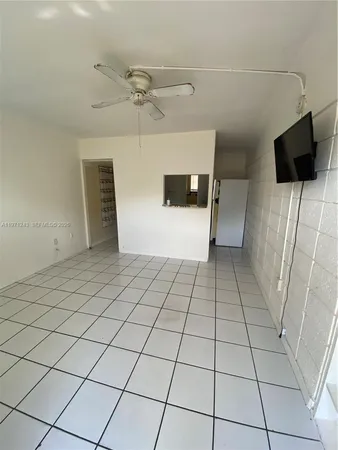 a view of a livingroom with an empty space and a sink