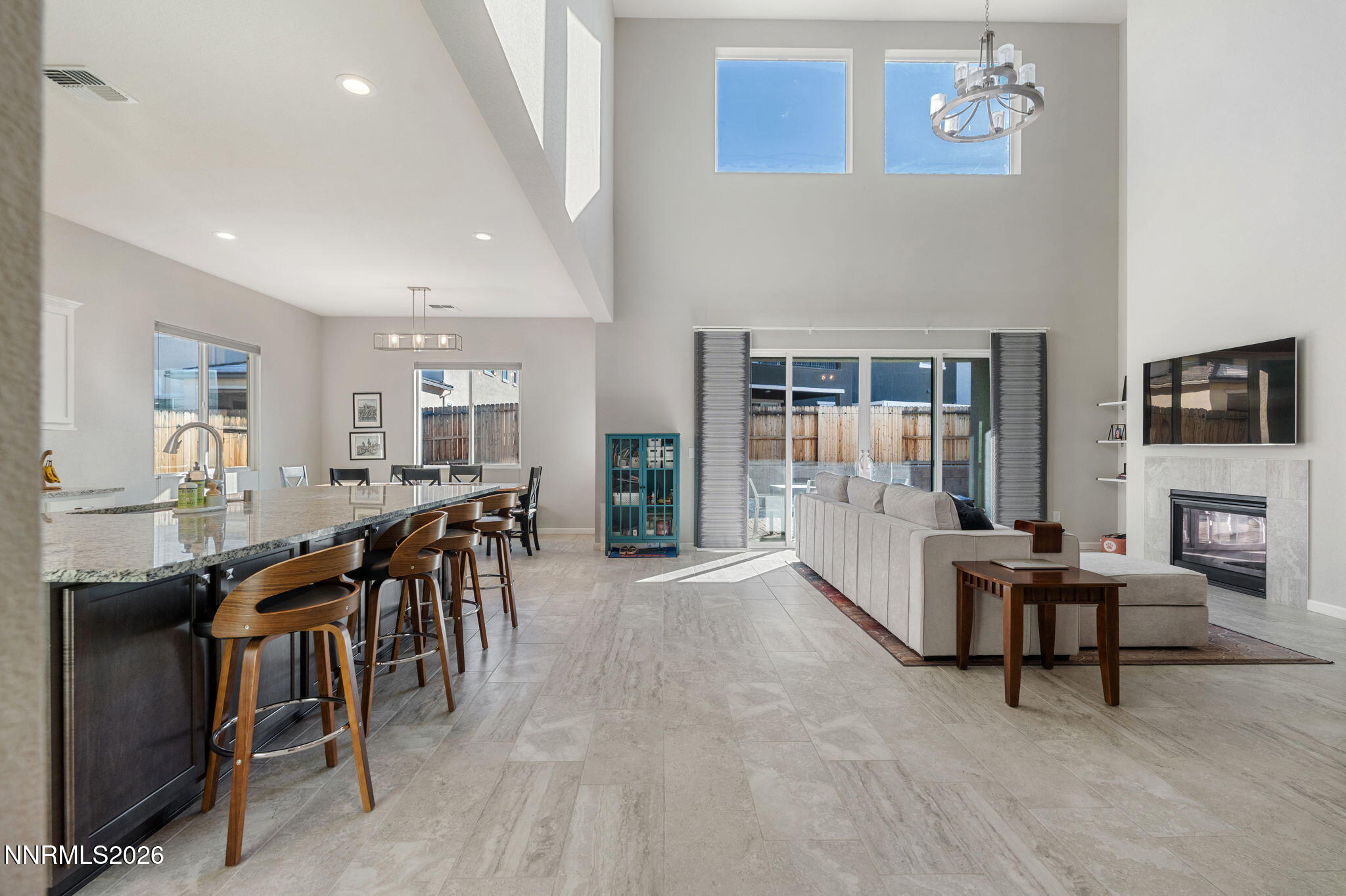 2370 Buttermere Drive Reno, NV 89521 - Photo 13 of 37 a living room with furniture a fireplace and a flat screen tv