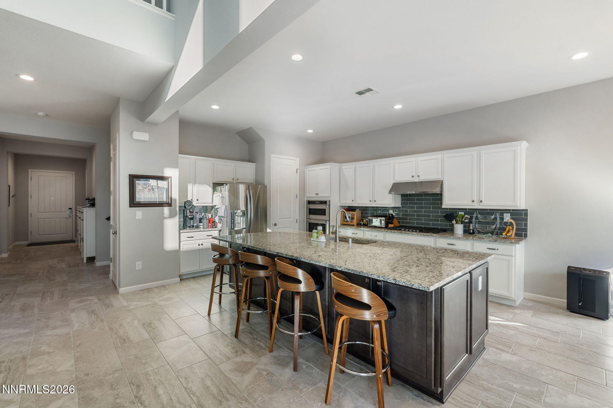 2370 Buttermere Drive Reno, NV 89521 - Photo 15 of 37 a large kitchen with a table and chairs in it