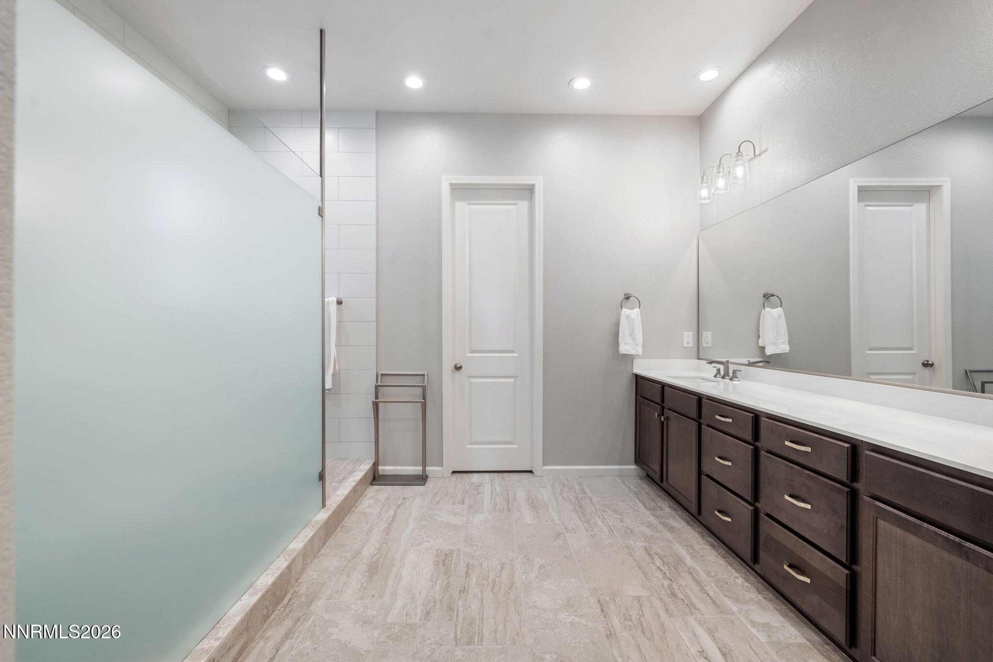 2370 Buttermere Drive Reno, NV 89521 - Photo 21 of 37 a spacious bathroom with a double vanity sink and a mirror