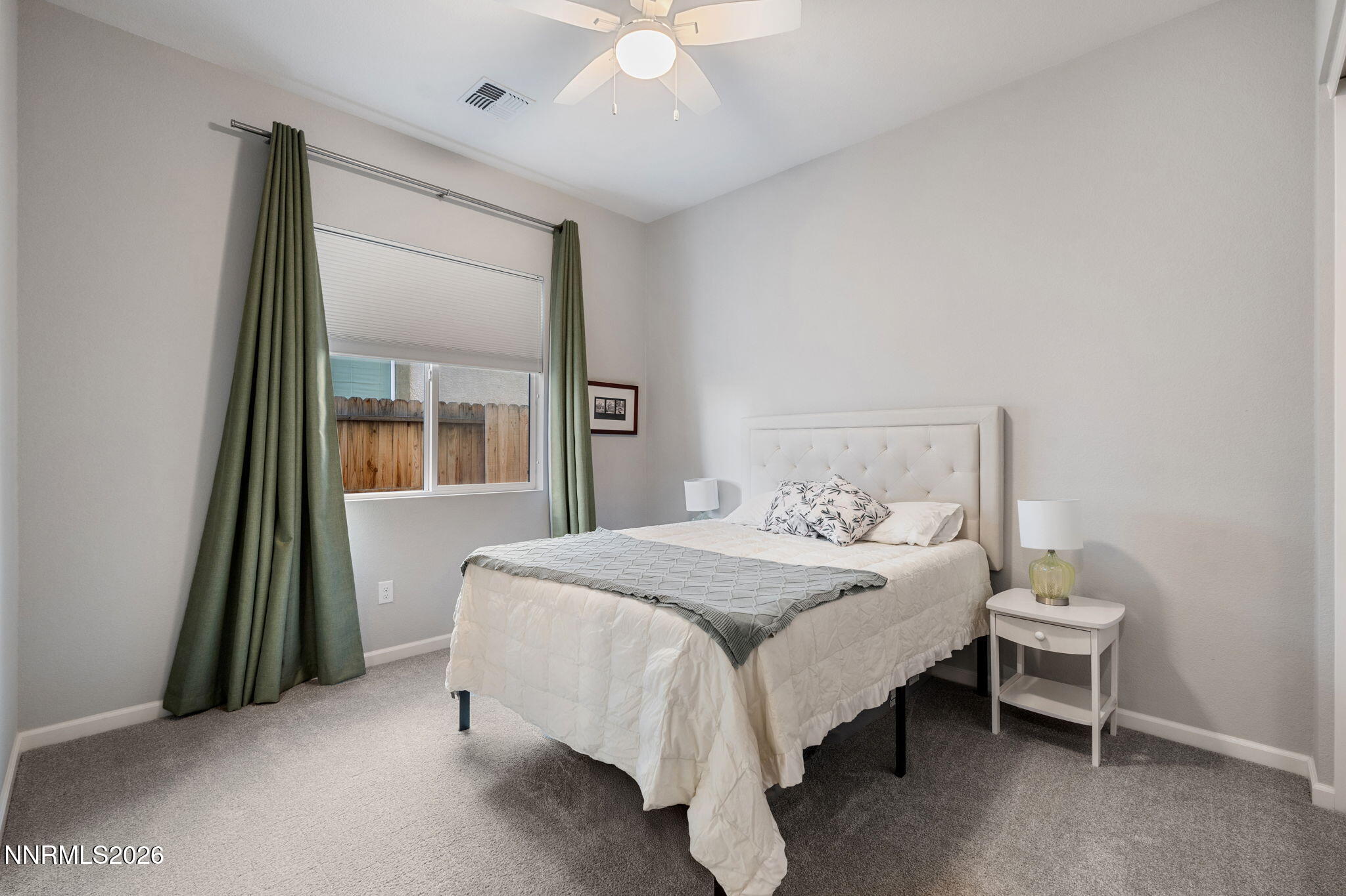 2370 Buttermere Drive Reno, NV 89521 - Photo 28 of 37 a bedroom with a bed and a chandelier